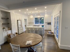 Modern kitchen with white cabinets and island.